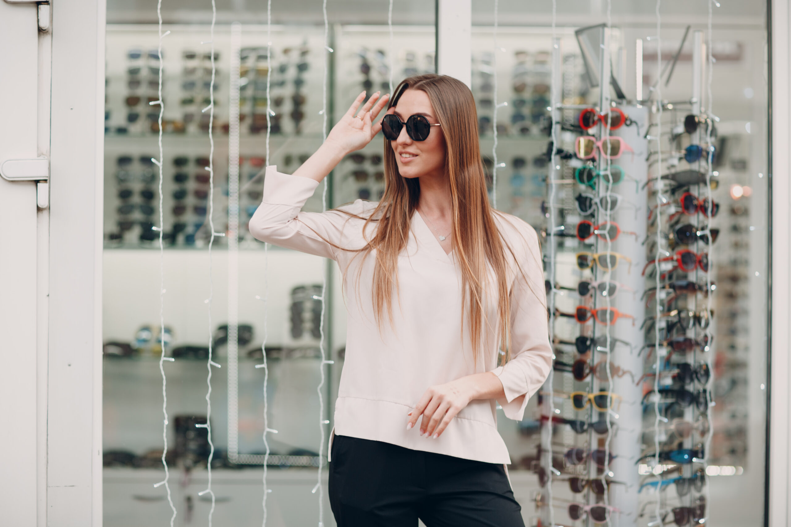 close up gorgeous young smiling woman smiling picking choosing glasses optician corner shopping mall happy beautiful woman buying eyewear eyeglasses optometrist scaled